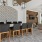 a room with a table chairs and a chandelier