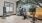 a room with exercise equipment and a tv